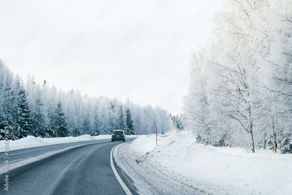 Landscape of car at road in snowy winter Lapland