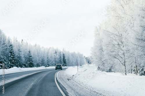 Landscape of car at road in snowy winter Lapland