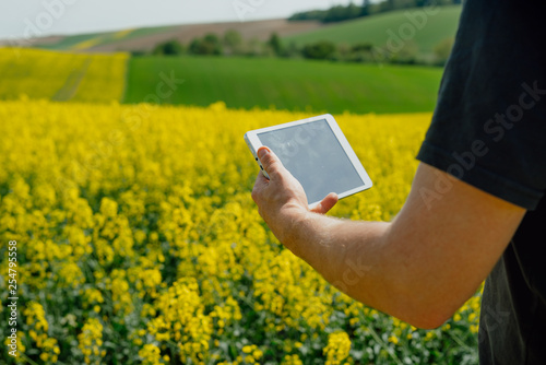 Farmer holding tablet