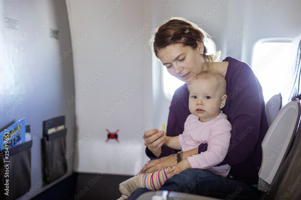Mother and baby daughter of board of air plane Mother and baby daughter of board of air plane