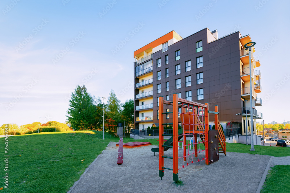 Apartment residential house facade architecture with child playground Apartment residential house facade architecture with child playground