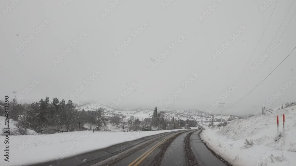Driving on countryside roads covered in winter snow in rural California Driving on countryside roads covered in winter snow in rural California