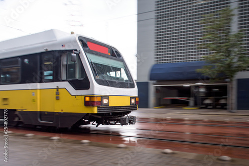 City Train Zooming Through Downtown