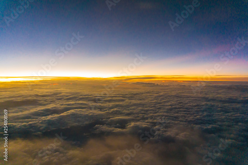 Colorful sunrise sky with cloud above view from airplane