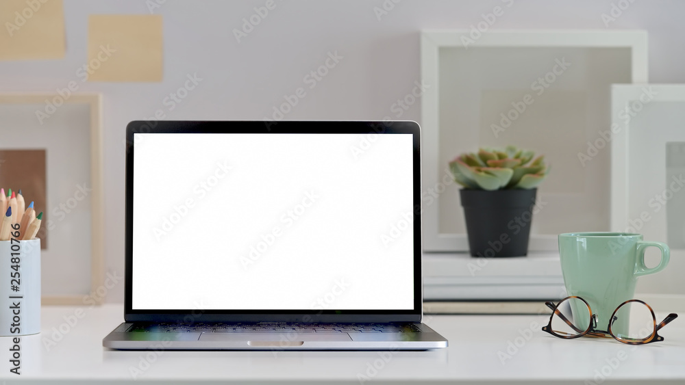 Stylish workspace with mock up laptop computer.. Stylish workspace with mock up laptop computer..