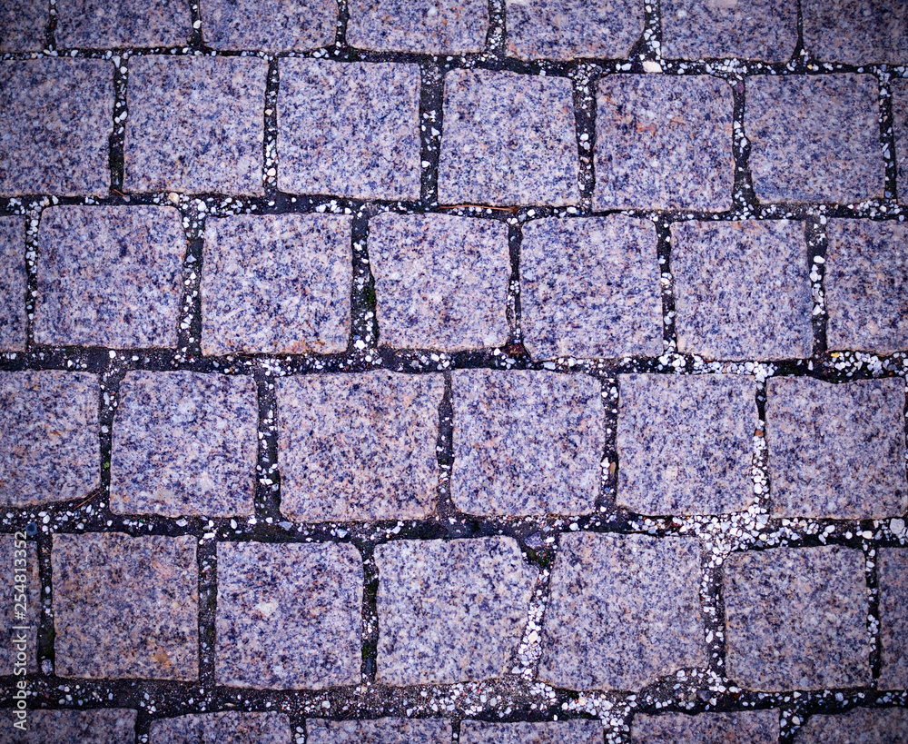 gray cobblestone tiled sidewalk pavement with vignette. background, texture. gray cobblestone tiled sidewalk pavement with vignette. background, texture.