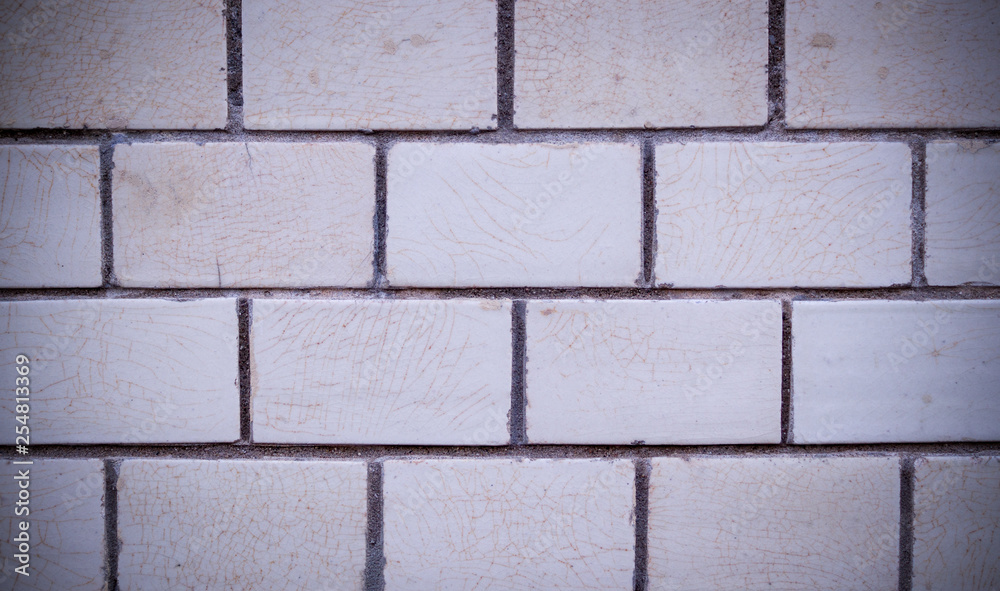 Fototapeta premium white decorative marble tiled brick wall with vignette. background, texture.