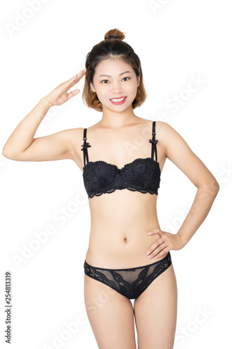 Chinese woman posing in panties and bra on white background