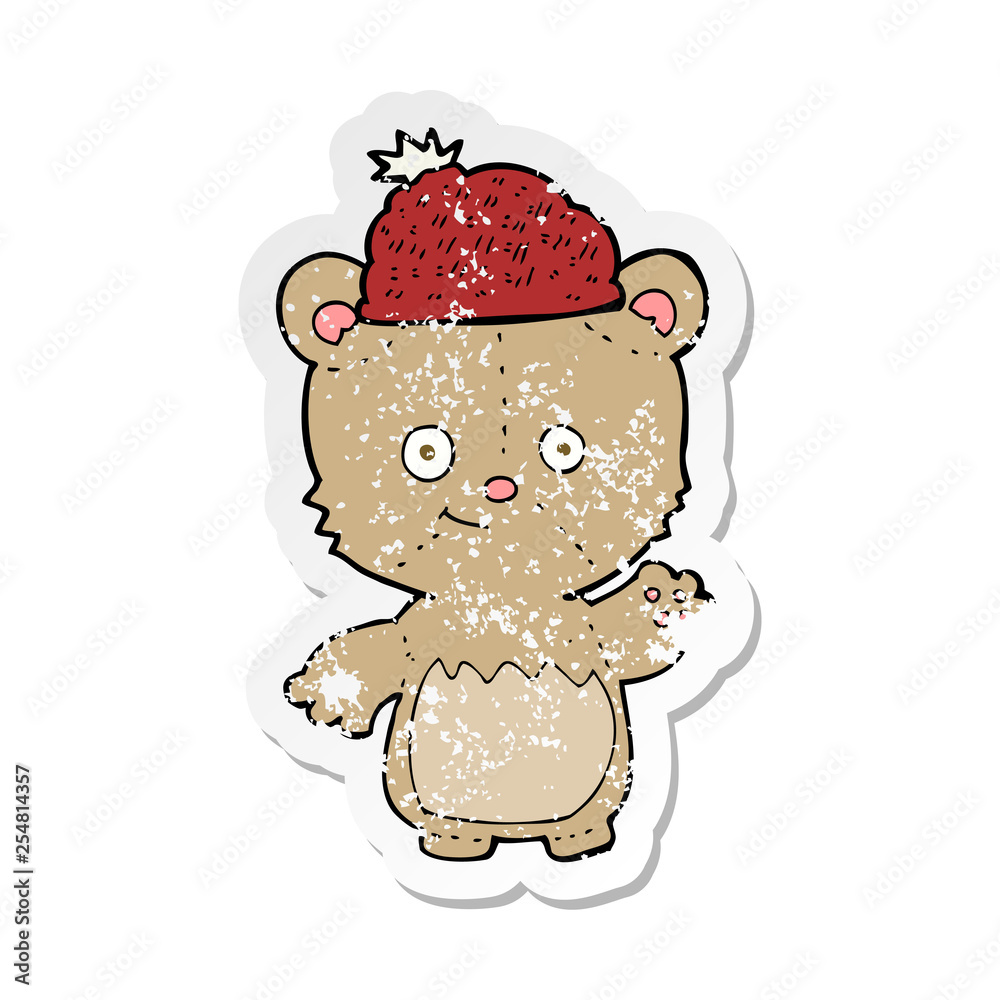 Fototapeta premium retro distressed sticker of a cartoon bear in hat
