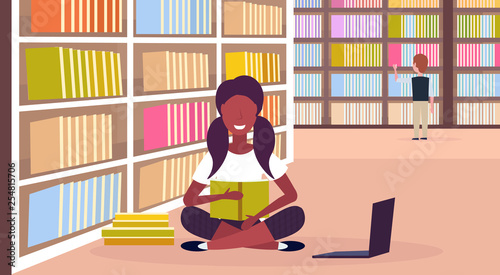 african american girl student sitting lotus pose reading book near bookshelf modern library interior education knowledge concept flat horizontal full length