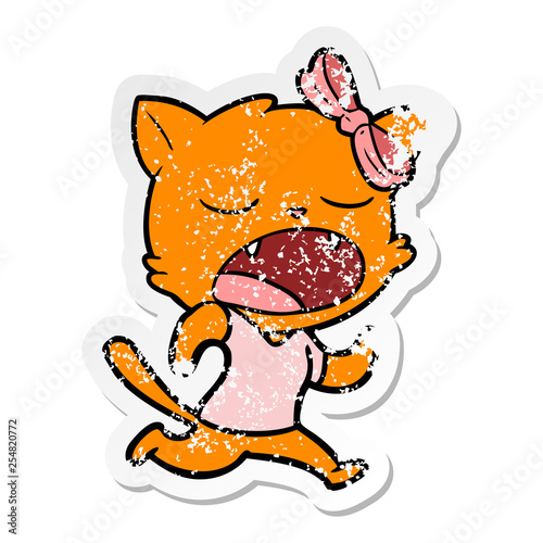 distressed sticker of a cartoon yawning cat