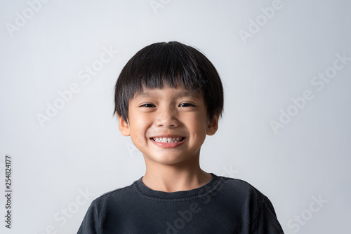 portrait of cute boy smiling, asian boy on white background photo