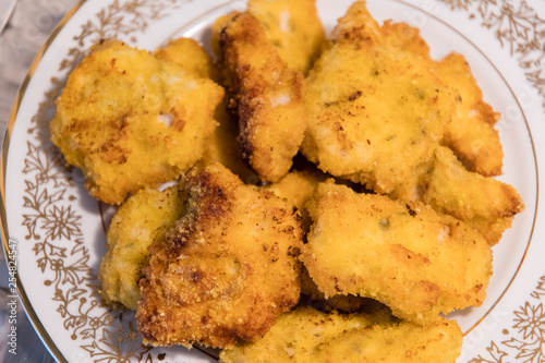 Fried cutlets on a plate.