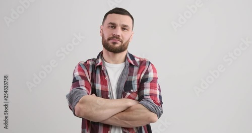 Handsome young man with arms crossed