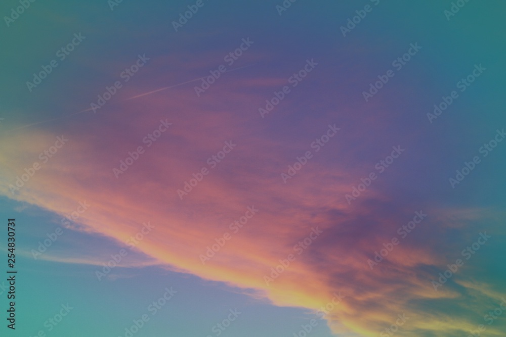 wonderful bright sun colored partially cloudy sky for using in design as background.