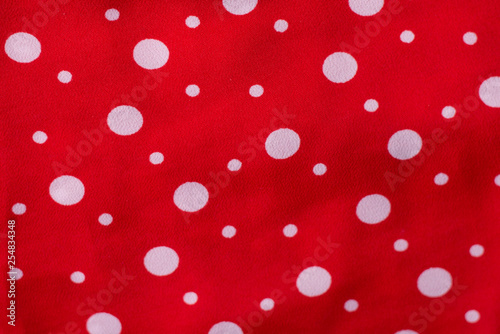 red fabric texture closeup, useful for background.Polka dot on red canvas cotton texture, fabric background