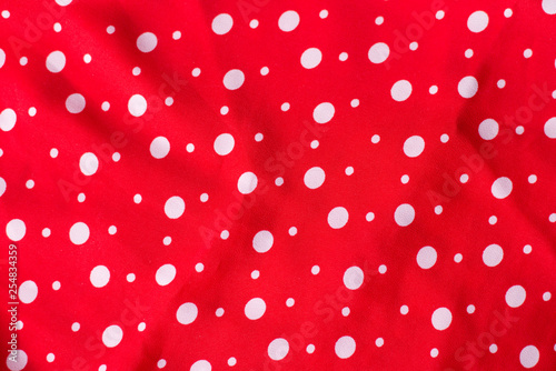 Polka dot on red canvas cotton texture  fabric background