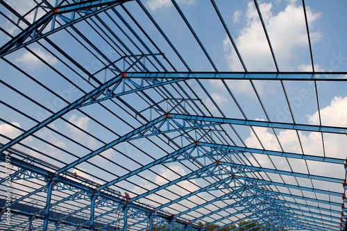 Wallpaper Mural Structure of steel roof frame for building construction on sky background Torontodigital.ca
