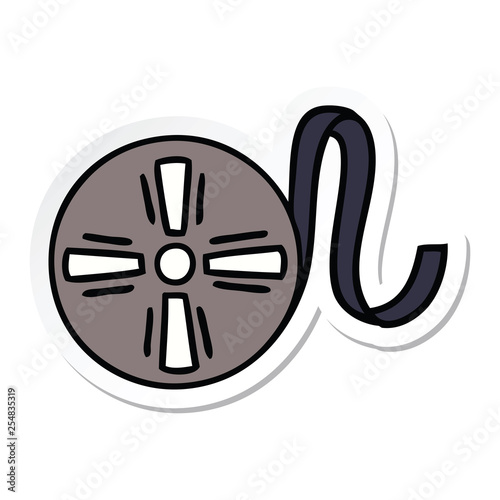 sticker of a cute cartoon movie tape