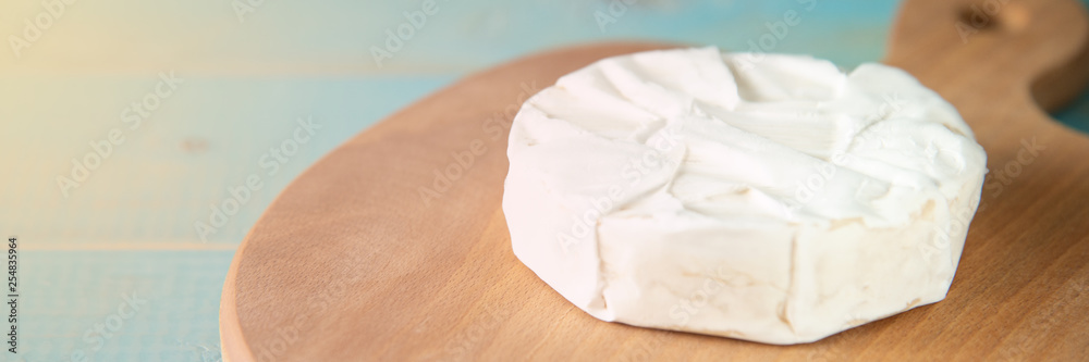 Cheese camembert or brie with walnut kernels Cheese camembert or brie with walnut kernels