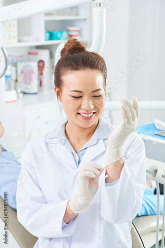 Female doctor preparing for work