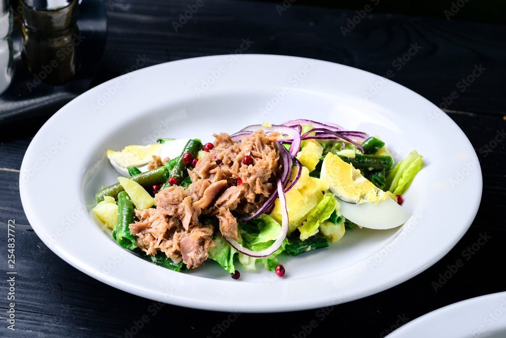 fresh vegetable salad on a black table in cafe restaurant fresh vegetable salad on a black table in cafe restaurant