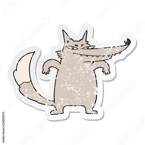 distressed sticker of a sly cartoon wolf
