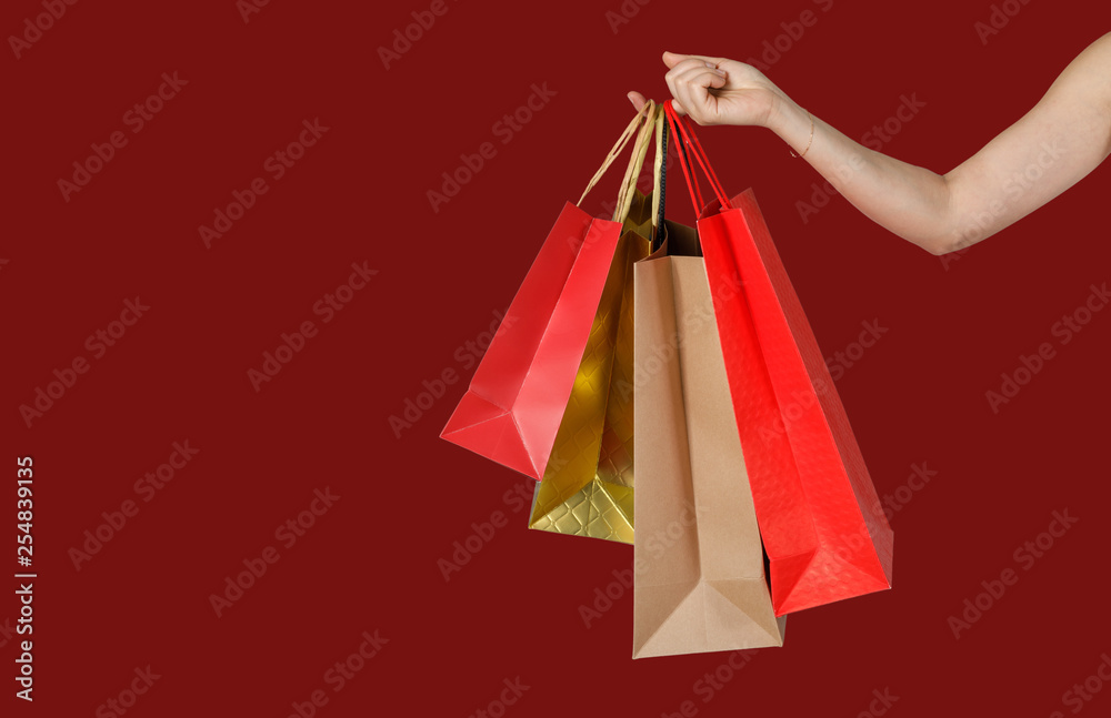 Shopping woman holding shopping bags in red background, Copy space for your text, E-commerce digital marketing lifestyle concept