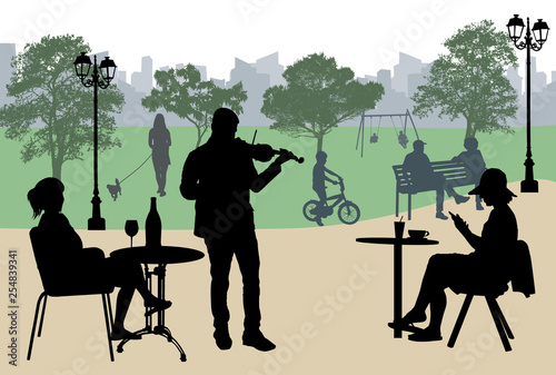 Violinist perform on a street cafe near city park