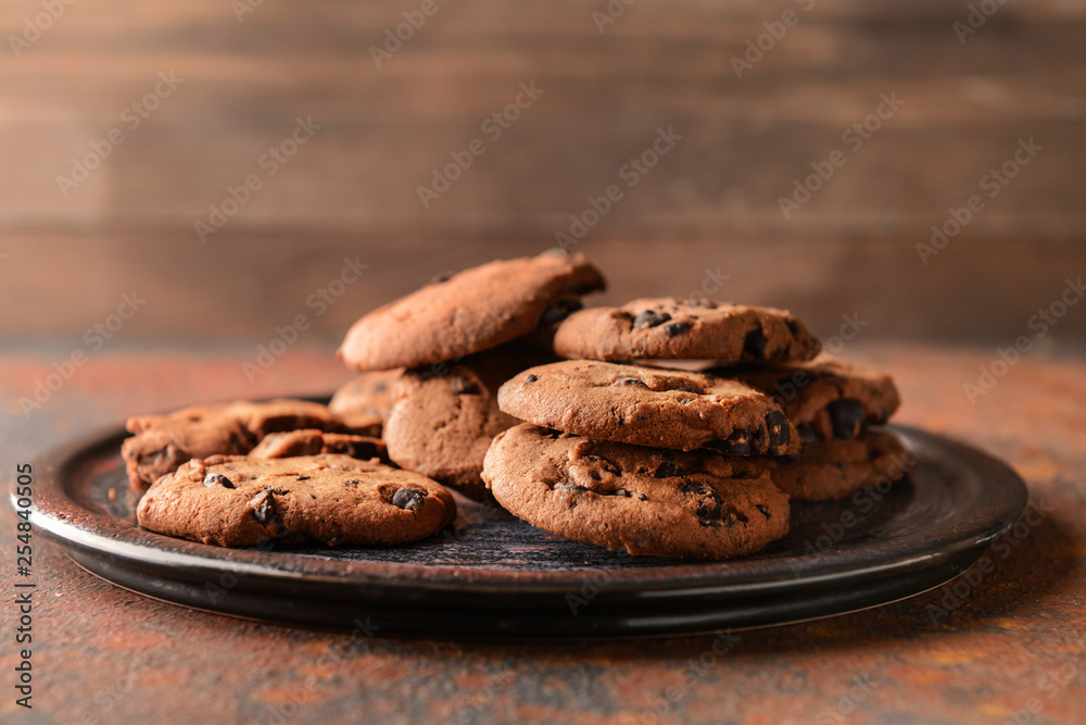 Fototapeta premium Tasty cookies with chocolate chips on plate