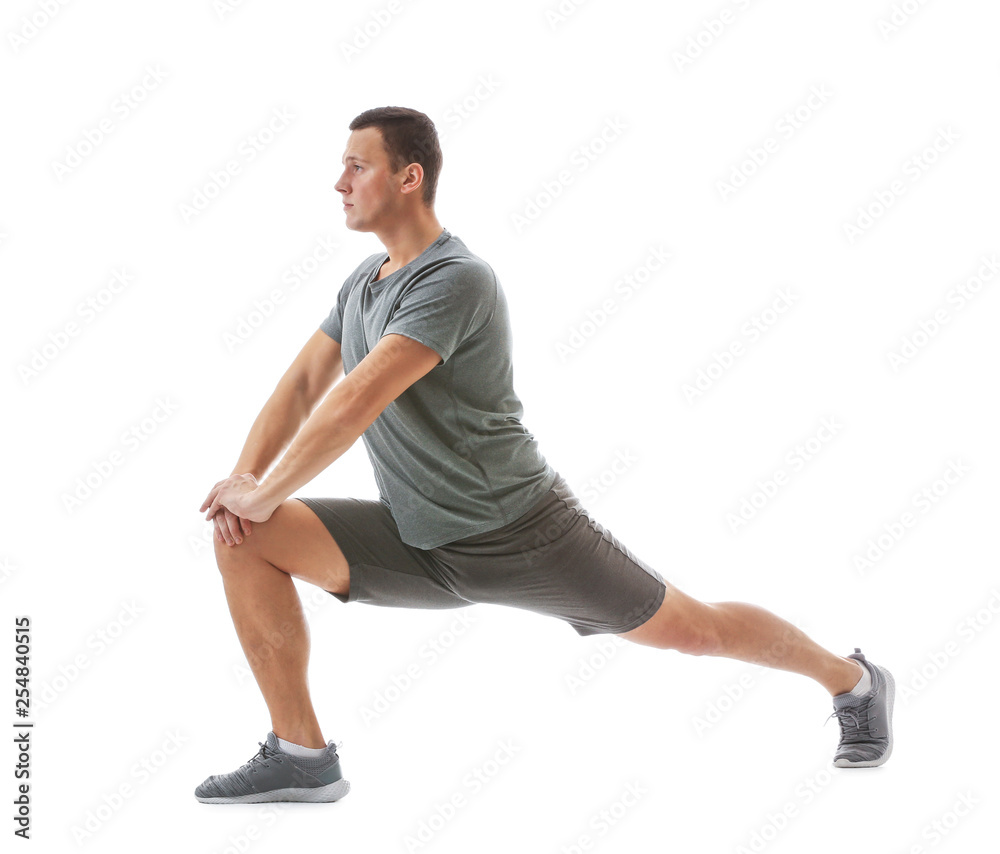 Sporty young man training against white background Sporty young man training against white background