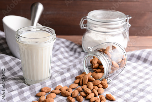 Composition with healthy almond milk on table