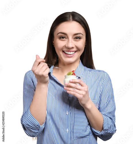 Young woman eating tasty yo...