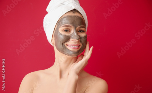 Woman with facial mask on c...