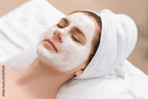 Woman with facial mask in b...