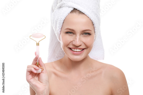 Young woman with facial mas...