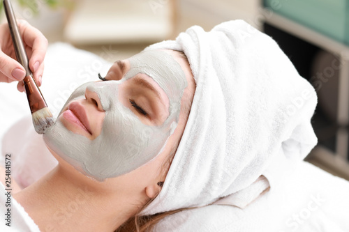 Cosmetologist applying mask...