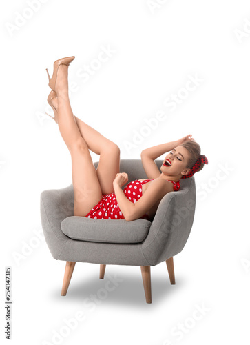 Beautiful pin-up woman sitt...