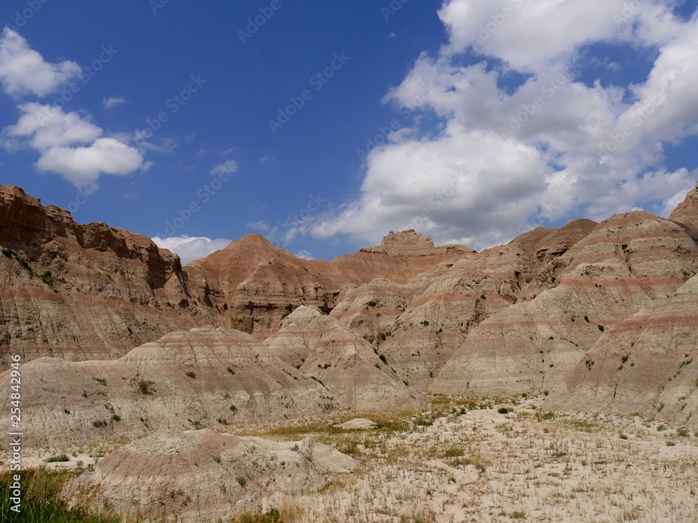 Dramatic landscapes at Badlands National Park in South Dakota, USA, with gorgeous clouds in the skies.
