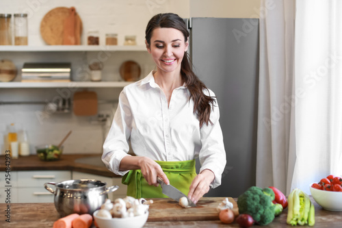 Beautiful woman cutting mus...