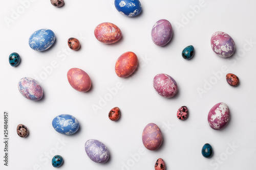 Stylish frame with colorful Easter eggs isolated on white background. Flat lay, Top view. Easter concept. Free space