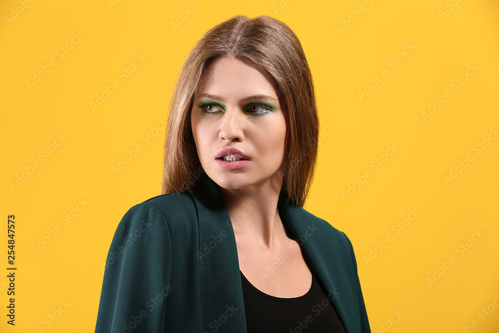 Beautiful young woman with bright makeup on color background Beautiful young woman with bright makeup on color background