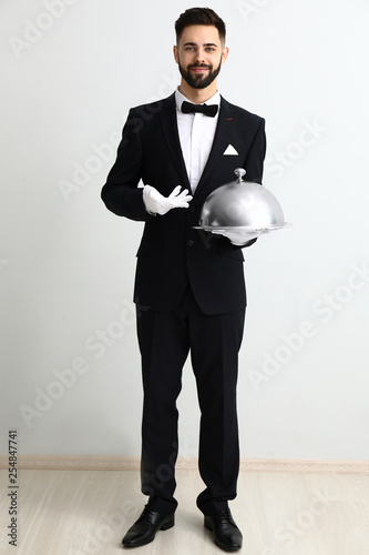 Waiter with tray and cloche...