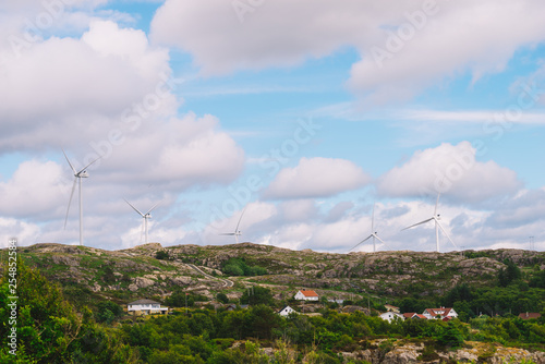 wind turbines farm on coast hills © anetlanda