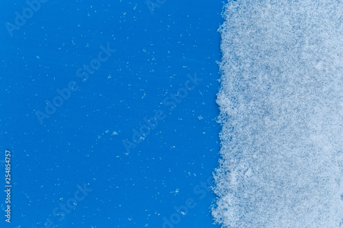 White snowy fields under a blue background
