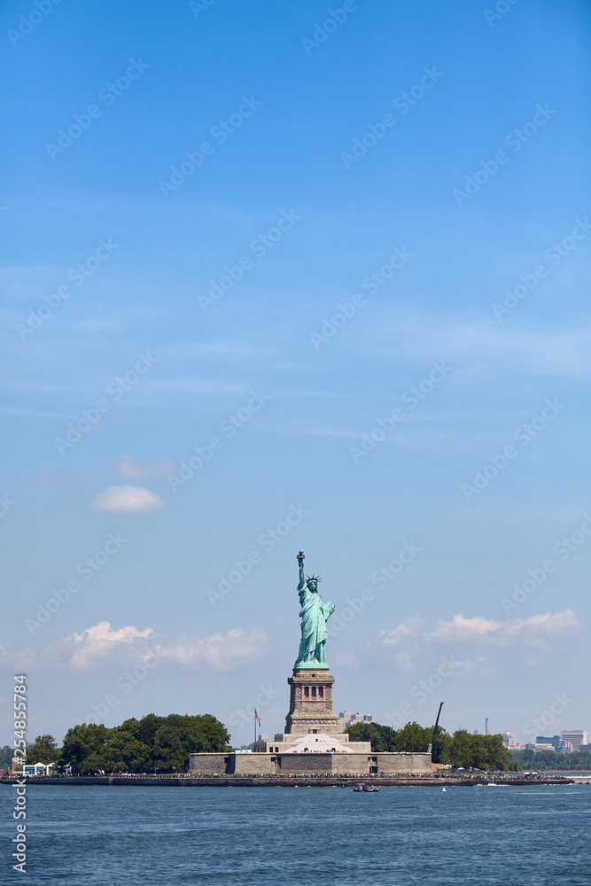 Statue of Liberty against the blue sky, New York, USA.