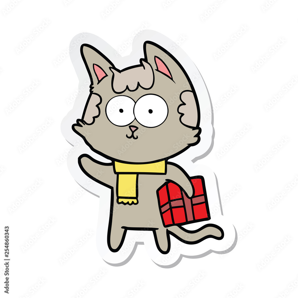 sticker of a happy cartoon cat with christmas present sticker of a happy cartoon cat with christmas present