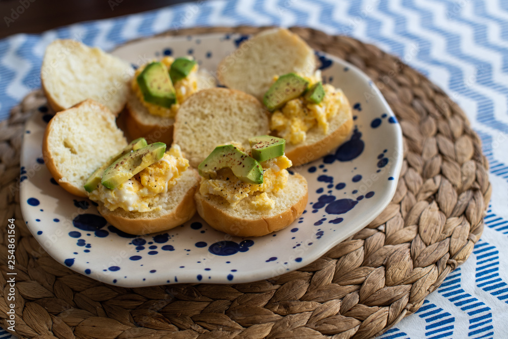 small sandwiches with avocado and scrambled eggs