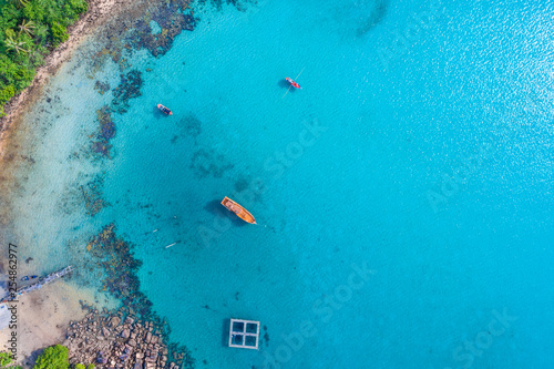 Aerial view of idyllic tranquil sea island deep blue turquoise water