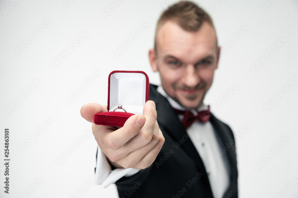 man holding a glass of red wine